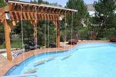 an empty swimming pool surrounded by trees