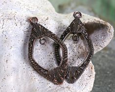 Greek bronze ornate open teardrops are beautiful focals. Highly detailed, these pieces are patterned on both sides. Easily add a charm or special bead to the inner loop. Top loop is approximately 1.5mm, inner loop is approximately 1.7mm. Whether you're making a charm bracelet or need an eye-catching focal to complete a design, you'll find what you need in this section. We've got everything from metal animal-themed charms to large glass tumbled rings. You can shop them all by material, style, or Bronze Metal Teardrop Earrings, Rhinestone Rose, Seed Shop, Enamel Beads, Felt Garland, Metal Shop, Beads Online, Bead Store, African Beads