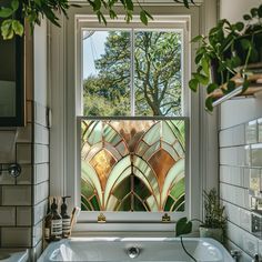 a bath tub sitting under a window next to a plant in a room with tiled walls