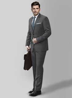 Enhance your appearance with our Loro Piana Antonella Wool Suit, showcasing a refined sense of elegance that defines your classy look. Meticulously crafted from pure wool fabric, The suit displays a polished stripe motif featuring a harmonious interplay of gray and distinguished blue hues. This amalgamation exudes an ageless charm, elevating it to the status of a true sartorial masterpiece. Whether you're attending a formal office meeting or a refined dinner event, this suit is designed to ensur Elegant Wool Suit And Tie Accessories For Business, Elegant Wool Suits For Office, Classic Striped Double Breasted Suit For Work, Pinstripe Wool Suit For Office, Tailored Striped Double Breasted Suit For Business Casual, Luxury Striped Blazer For Formal Occasions, Pinstripe Wool Suits For Formal Occasions, Elegant Wool Double Breasted Suit For Office, Pinstripe Notch Lapel Suits For Business