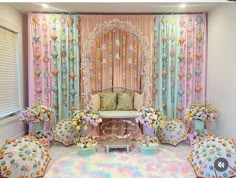 a living room filled with lots of furniture and flowers on top of the carpeted floor