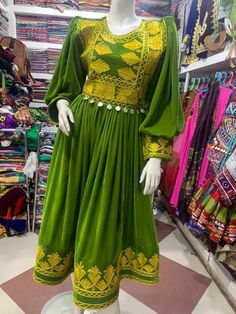 Afghani green dress with white pants and scarf Green Long Sleeve Festive Dress, Elegant Green Dresses For Festive Occasions, Traditional Green Long Sleeve Maxi Dress, Traditional Long Sleeve Green Maxi Dress, Festive Long Green Dress, Elegant Green Festive Maxi Dress, Green Fitted Long Dress, Long Fitted Green Dress, Traditional Green Floor-length Dress