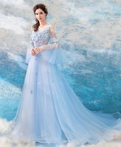 Blue Long Sleeve Gown For Prom, Tulle Long Sleeve Dress With Sweep Train, Long Sleeve Tulle Dress With Sweep Train, Blue Tulle Evening Dress For Banquets, Blue Long Sleeve Dress For Prom Season, Blue A-line Tulle Evening Dress, Blue Tulle Evening Dress For Banquet, Blue Tulle Dress For Banquet, Light Blue Tulle Dress For Banquet