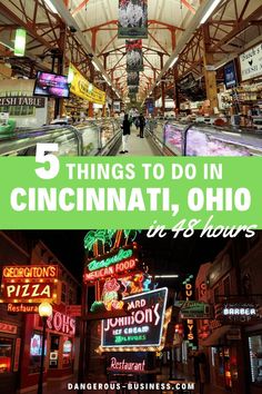 the inside of a building with neon signs and people walking around it in front of them