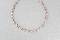 This delicate rose gold bridal necklace is set with marquise cubic zirconia and was made to make your wedding day shine a little brighter! - Crafted with Swarovski Pure Brilliance cubic zirconia stones - Necklace measures 16 inches and extends to 18 inches with an extension chain. (extension chain not pictured in photos) - Available in rose gold, yellow gold and rhodium finish - Nickel free and hypoallergenic - PLEASE ALLOW APPROX 5 BUSINESS DAYS FOR COMPLETION BEFORE SHIPPING ** if you would li Delicate Rose Gold Diamond Necklace For Wedding, Delicate Marquise Necklace For Wedding, Delicate Marquise Wedding Necklaces, Rose Gold Cubic Zirconia Diamond Necklace For Wedding, Feminine Rose Gold Wedding Necklaces, Rose Gold Crystal Bridal Necklace, Delicate Rose Gold Cubic Zirconia Bridal Necklace, Festive Rose Gold Bridal Necklace, Elegant Rose Gold Crystal Bridal Necklace