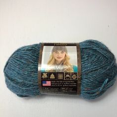 a blue ball of yarn with a label on it