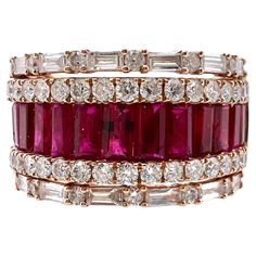 This is an exquisite ruby and diamond band that will go with any outfits. It's the perfect smart casual band with the channel set ruby baguettes in the the middle with round and baguette diamonds on the shoulders. Size: 6.25 (can be resize) Ruby: 1.27 cts, Baguette Diamonds: 0.45 cts, Round Brilliant / Baguette Metal: 18k Rose Gold Luxury Pink Baguette Cut Ruby Ring, Luxury Red Ruby Ring Baguette Cut, Luxury Red Baguette Cut Ruby Ring, Luxury Lab-created Ruby Ring, Luxury Ruby Ring With Diamond Baguette Cut, Luxury Diamond Ruby Ring With Baguette Cut, Red Ruby Ring With Baguette Diamonds, Luxury Red Baguette Diamond Jewelry, Elegant Ruby Ring With Baguette Diamonds For Formal Occasions