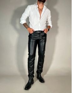 Product Description: Elevate your wardrobe with these Men's Slim-Fit Genuine Cow Leather Pants, meticulously crafted from premium-quality authentic leather. These sleek, black leather trousers offer a timeless style with a modern fit, perfect for the discerning man. The supple Cow leather delivers a luxurious feel, providing a unique blend of softness and durability that only genuine leather can offer. Designed for both comfort and style, these pants feature a slim-fit cut that flatters your fig White Shirt Black Leather Pants, Luxury Leather Pants For Men, Luxury Men's Straight Leather Pants, Guys In Leather Pants, Men’s Black Leather Pants Outfit, Mens Leather Pants Goth, Mens Leather Pants, Black Leather Pants, Leather Trousers