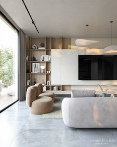 a living room with two chairs and a television on the wall in front of it