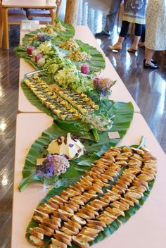 a long table filled with lots of food on top of it's sidelines