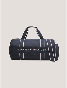 Tommy Hilfiger men’s bag. Our duffle features an adjustable shoulder strap for easy toting and is lined to keep your gear dry. Designed from lightweight but durable polyester and made memorable with logo branding.  Material: 100% Polyester Pes. Functional Travel Shoulder Bag With Logo, Black Bag With Logo Tag For Travel, Black Travel Bag With Logo Tag, Tommy Hilfiger Travel Bags With Zipper Closure, Sporty Everyday Shoulder Bag With Logo, Sporty Rectangular Bag With Logo, Nylon Bags With Logo For Outdoor Activities, Nylon Bag With Embroidered Logo For Everyday Use, Casual Everyday Bag With Logo Tag