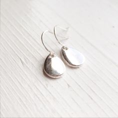 "-I make these little raindrop earrings using antique silver charms with French hook style ear wires -These measure 3/4\" long with the French hook ear wires -Nickel free lead free ear wire metal -.925 Sterling Silver ear wire option -Gift Boxed I Make This Pair of Earrings in Antique Brass Finish Also: https://www.etsy.com/listing/491195308/raindrop-earrings-minimalist-little-rain?ref=shop_home_active_1 More of my Earrings: https://www.etsy.com/shop/lydiasvintage?ref=hdr_shop_menu&section_i Raindrop Earrings, Steampunk Jewelry, Earrings Minimalist, Rain Drops, Bridesmaid Jewelry, Minimalist Earrings, Ear Wire, Silver Charms, Anklets