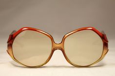 "Vintage 80s eyeglasses Christian Dior Optyl translucent orange color. High quality materials. Large frame with personality. They have a prescription lens that could be replaced. Frame Germany / Model: 2021-30 / Size: 54▢13-125. Ref: OB0030 CONDITION: Excellent DIMENSIONS: Bridge: 13 mm / 5,12\" Lens width: 54 mm / 21,26\" Lens height: 55 mm / 21,65\" Frame width: 134 mm / 52,76\" Temple length: 125 mm / 49,21\" More vintage items in my online shop: http://www.vintagecarwen.com" Retro Anti-reflective Glass Sunglasses, Retro Clear Sunglasses For Party, Orange Retro Sunglasses For Party, Party Sunglasses With Orange Gradient Lenses, Vintage Orange Sunglasses With Mirrored Lenses, Vintage Orange Sunglasses With Uv Protection, Modern Orange Plastic Sunglasses, Vintage Hermes Scarf, Pearl Logo