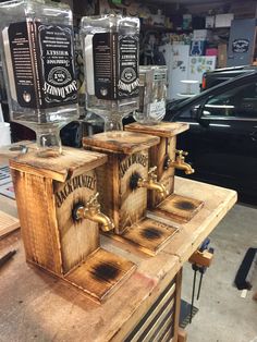 three wooden boxes sitting on top of a table