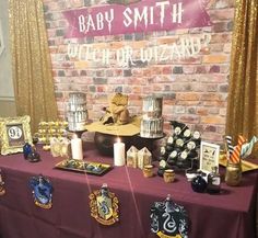 a table topped with lots of harry potter themed items and decorations on top of it