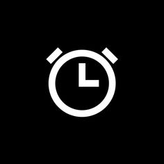 a black and white clock icon on a dark background