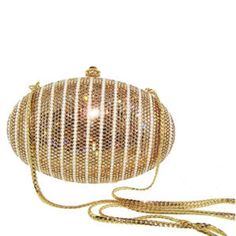 "Heart- stoppingly beautiful design and sparkle! These Evening Formal Oval shaped Purses in gold, gold with pearls and ALL CLEAR will be the talk of town!! Each is handmade. Each takes months to complete, one crystals at a time! Here at Etsy, we offer you the best quality at discounted prices, a fraction of what high priced retailers charge! These are evening bags that are fully covered in genuine, very fine, small sized Swarovski Crystals from Austria! One purse is in all CLEAR CRYSTALS, One is Elegant Evening Bag With Crystal Bling, Elegant Crystal Evening Bag With Bling, Elegant Sparkling Crystal Evening Bag, Luxury Gold Clutch For Gala, Luxury Bling Clutch For Formal Occasions, Luxury Bling Clutch For Formal Events, Luxury Formal Clutch With Bling, Luxury Sparkling Clutch For Events, Gold Sparkling Evening Bag For Formal Occasions