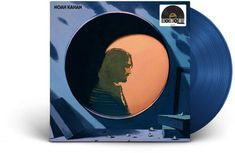 a blue vinyl album cover with a man's profile