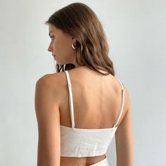 Step into summer with style in our Elegant White Linen Marta Crop Top. A blend of 80% linen & 20% cotton ensures breathability and unparalleled comfort. Its relaxed fit and adjustable straps make it versatile for all occasions. Pair it with our matching trousers for an effortlessly chic look.  Also available in beige and black.   Details: Breathable fabric Perfectly pairs with our linen Marta trousers Relaxed fit Adjustable shoulder straps  Discover timeless style at KK. We take care of you with How To Be Graceful, Everyday Wardrobe, Mens Jewelry Bracelet, White Linen, Summer Essentials, Stunning Dresses, Heart Jewelry, Independent Designers Fashion, Designs To Draw