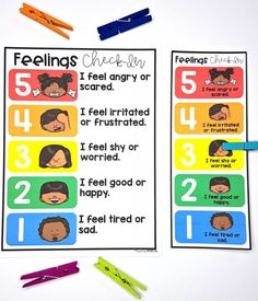 feelings checklist with markers and pens on the table next to it are five different types of feelings