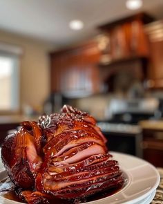 a large piece of meat sitting on top of a white plate