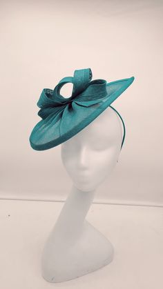 Beautiful sinamay Teal Blue fascinator. Option for a veil or no veil. Wedding Fascinator Bridesmaids Hat Kentucky Derby Cocktail Party Tea Party Guest Easter Kate Middleton  - Headband and hairclip  - Ready to ship  - Lightweight - Free Shipping - Fast shipping - Customize by adding different color flowers and or feathers Check my store for styles and colors.  Hatsandpearls.etsy.com Find more at my website: Www.hatsandpearls.com  Reach out to me if you can't find what you are looking for.  I can make cake custom orders and help you style and match your outfit  Tag and share your pictures when you wear and style our hats.  Instagram: @hats_pearls Facebook: Hats Pearls Thank you for visiting and happy shopping! Fitted Sinamay Mini Hats For Summer, Fitted Sinamay Fascinator For Summer, Summer Fitted Sinamay Fascinator, Summer Party Mini Hats Made Of Sinamay, Fitted Sinamay Boater Hat For Party, Fitted Sinamay Fascinator For Church, Summer Fascinator With Structured Crown In Sinamay, Summer Party Headpiece In Sinamay, Adjustable Sinamay Fascinator For Summer