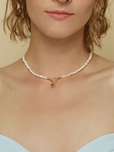 Easy to style and endlessly versatile, the Elena Pearl Choker is the epitome of beauty and elegance. Don’t have time to stylize yourself? Let this exquisite white pearl choker with gold-plated over brass string make a true fashion statement. This beautiful neckpiece is the perfect pick to pair up with casual jeans and a t-shirt.- Gold plating over brass- Freshwater pearl White Pearl Choker, Pearl Choker, Pearl Size, White Pearl, Casual Jeans, Gold Plating, Pearl White, Fashion Statement, Freshwater Pearls