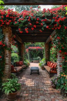 an outdoor patio covered in red flowers and greenery