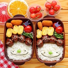 two plastic containers filled with food on top of a wooden table next to fruit and vegetables