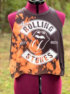 This Rolling Stones graphic tea has been distressed and bleached eyed. Sleeves have been removed making it a tank top. Great rocker shirt! Size medium, but will fit large. Grunge Tank T-shirt For Summer, Summer Grunge Tank T-shirt, Stonewashed Cotton Band Merch Tops, Trendy Bleached Faded Top, Trendy Faded Bleached Top, Stonewashed Tops For Summer Streetwear, Festival Cotton Top With Soft-washed Detail, Soft-washed Cotton Top For Festival, Festival Cotton Tops Soft-washed