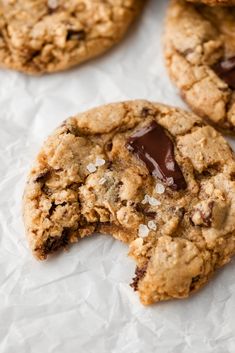 chocolate chip cookies on top of white paper