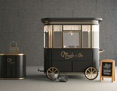 an old fashioned ice cream cart next to a chalkboard sign