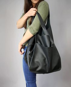 "Soft Leather Tote, Black Slouchy Tote, Black Work Bag, Letaher Shoulder Bag, Black Oversized Handbag, BOLOGNA BAG My structure: I'm very soft (you can easily fold me and fit into a suitcase when travelling) with an external open front pocket, a top magnet fastening, an inside zip pocket and a slip pocket right behind it. My base panel is also soft, not reinforced. If you're in search of a tote with a more rigid structure, take a look at my cousins - ROME bag https://etsy.me/2P68I37 or MILAN bag Leather Work Bag, Slouchy Tote, Soft Leather Tote, Large Leather Bag, Brown Tote Bag, Leather Weekender Bag, Soft Leather Bag, Stylish Tote Bag, Work Tote Bag