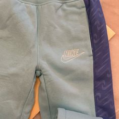 Brand New Girls Nike Sweatpants. Toddler Size 6 Blue Playwear Pants With Elastic Waistband, Blue Pants With Elastic Waistband For Playwear, Nike Blue Cotton Pants, Light Blue Cotton Sports Bottoms, Light Blue Cotton Sport Bottoms, Blue Bottoms With Pockets For Playwear, Casual Blue Pants For Playwear, Casual Purple Playwear Bottoms, Casual Purple Bottoms For Playwear