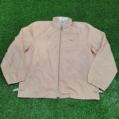 Vintage IZOD Lacoste Blouson Jacket Large 27x30 Beige Elevate your style with this vintage IZOD Lacoste blouson jacket in large, a timeless beige piece!  * Used condition  * Length is on the shorter side  * No rips/holes  * Stains (see picture and zoom in to see size/location)  * Normal fading from washing VINTAGE IZOD LACOSTE JACKET, BLOUSON JACKET, LARGE JACKET, BEIGE JACKET, RETRO CLOTHING, VINTAGE APPAREL, 27X30 JACKET, CLASSIC STYLE, RETRO FASHION, IZOD LACOSTE VINTAGE 68556 Classic Beige Outerwear For Streetwear, Vintage Khaki Long Sleeve Windbreaker, Casual Cream Windbreaker For Streetwear, Vintage Beige Outerwear For Streetwear, Vintage Windbreaker For Fall, Casual Beige Windbreaker For Streetwear, Casual Beige Windbreaker, Casual Beige Long Sleeve Windbreaker, Beige Long Sleeve Casual Windbreaker