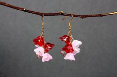 Red And Pink Lily Of The Valley Gold 925 Plated Earring These dangling earrings are a perfect gift for those floral fans or even for yourself! ♡ Materials & Sizes ♡  The earring hooks are 925 gold plated, and perfect for people with sensitive ears. The flowers are made from glass, and the chain is made from gold plated metal, zinc alloy free from nickel! The earrings are 5cm length x 2cm, these are cute and dainty, perfect for those special occasions. ☆ Handmade In The UK! ☆ ☆ SHIPPING! ☆ We use Red Flower Earrings With Ear Wire For Party, Red Flower Earrings For Gift, Red Flower Earrings As Gift, Red Dangle Flower Earrings For Valentine's Day, Whimsical Red Party Jewelry, Red Flower Drop Earrings For Wedding, Whimsical Red Jewelry For Valentine's Day, Red Flower Earrings With Ear Wire For Gift, Red Flower-shaped Earrings For Anniversary