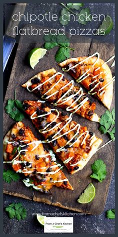 a wooden cutting board topped with pizza slices covered in cheese and toppings next to cilantro