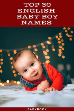 a baby laying on top of a bed with christmas lights behind it and the words top 30 english baby boy names