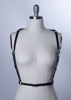 Slim, delicate harness belt in pvc or leather. Sits at waist. Buckles at waist and shoulders for an adjustable fit. Silver-toned nickel plated steel hardware. Straps converge into a flattering v design in back. Unisex and reversible fit. The perfect harness to add a little bit of edge to a classic outfit. Shown in black and clear PVC. Also available in leather and vegan leather. All pieces are MADE TO ORDER, standard sizes XS-4XL. If your measurements fall outside these standards or you are unsu Fall Outside, Body Armour, Harness Belt, V Design, Classic Outfit, Inverted Triangle, Body Armor, Clothing Inspiration, Natural Tan