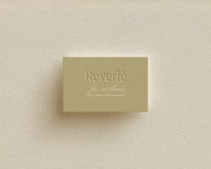 a small square box sitting on top of a white wall with the words revertc