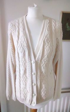 PLEASE CLICK ON "Learn more about this item" BELOW FOR DETAILED DESCRIPTION We love a cardy here at BJV. They are so versatile and perfect for taking out on an autumn evening to keep that chill off. This is a gorgeous cable-knit Cardigan produced by Honeybells, we think, in the 1980s. It has that early 1980s, Victorian look. The Cardigan is cream in colour with a gorgeous aran-style cable design on the front. The rest of the Cardigan has a textured knit design. It has a deep V-neck with a button Autumn Evening, Cable Knit Cardigan, Style Sweater, Textured Knit, Jumpers And Cardigans, Knitting Designs, Things To Buy, Cardigans For Women, Knit Cardigan