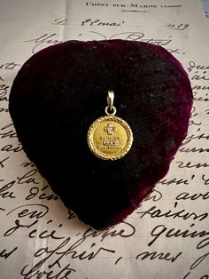 "Augis  \"Love Medal\", \"Médaille d'Amour\" 18 ct gold pendant. The phrase \"+ Qu'hier - Que Demain\" is beautifully engraved on this pendant, bringing the message of Love.  Let You to know some history behind.  The Love Medal was born in 1907, in the Lyon workshops of the A.Augis House. Its creator Alphonse Augis, grandson of the founder of the House, then had the idea of transcribing the verses of a famous poem by Mrs. Rosemonde Rostand entitled \"The Old Ones\" dating from 1889, a true declaration of love to her husband Edmond Rostand. \"Because you see every day I love you more, today more than yesterday and much less than tomorrow.\" The drawing varies, but usually includes a quote from a poem with \"more than\" and \"less than\" represented by plus and minus signs, often decorated w Elegant Commemoration Jewelry With Charms, Gold Medallion Jewelry For Valentine's Day, Hallmarked Pendant For Anniversary, Personalized Vintage Medallion Charm Necklace, Engraved Gold Plated Amulet Medallion Necklace, Valentine's Day Brass Medallion Jewelry, Valentine's Day Yellow Gold Medallion Necklace, Edmond Rostand, Famous Poems