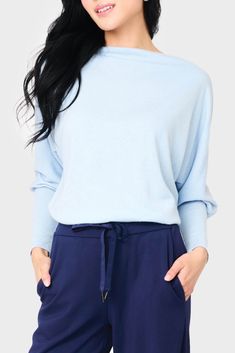 This sweater knit top is the epitome of relaxed style. With its eased fit and slouchy/off-shoulder design, it exudes effortless charm. The long sleeves feature high cuffs, adding a touch of sophistication. Made from super soft fabric, it offers both comfort and a luxurious feel. 50% Rayon | 28% Polyester | 22% Nylon Hand Wash Cold, Dry Flat Length 25 1/2" (size small) Drape Wide Neck Long Dolman Sleeve Eased Fit Easy 30-Day Returns & Exchanges Jing is 5'3 and wearing size XS Wide Neck Top, Business Casual Sweater, Business Casual Top, Open Neck, Womens Business Casual, Light Blue Sweater, Summer Party Dress, Casual Sweaters, Shoulder Design