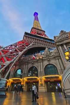 the eiffel tower is lit up in red, white and blue for people to see