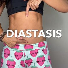 a woman showing off her stomach with the words diastasis written on it in front of her