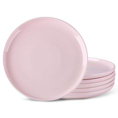 pink plates stacked on top of each other