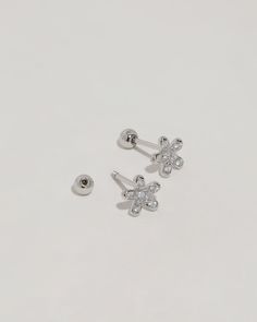 Material: High-Quality Solid 925 Sterling Silver (Nickel-Free and Lead-Free) Stones: Cubic Zirconia Colors: Silver, Gold, and Rose Gold Dimension: 0.25 x 0.25 Inches Approximately (Length x Width) Earring length-11mm, Post-0.8mm, Gauge-0.7mm, Ball back-3mm Packaging: Complimentary Gift Box and Jewelry Pouch Processing Time: Each item is handmade with love as we receive orders. Our production time is 2 to 5 business days. We will ship as soon as your item is ready! Care Instructions: Sterling sil Silver Dainty Diamond Earrings With Sparkling Stones, Fine Jewelry Silver Piercings With Diamond Accents, Sterling Silver Piercings In White Gold With Diamond Accents, Fine Jewelry Silver Diamond Piercing, White Gold Sterling Silver Piercings With Diamond Accents, Fine Jewelry Diamond Silver Piercing, Sterling Silver Piercings For Anniversary, Silver Diamond Piercing In Fine Jewelry Style, Elegant Rose Gold Sterling Silver Flower Earrings