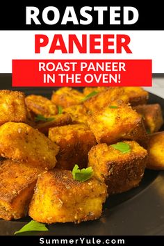 roasted paneer in the oven on a black plate with text overlay that reads roasted paneer roaster in the oven