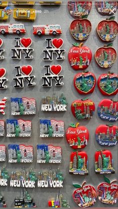 new york pins and magnets on display in a store window, with an american flag theme