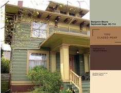 a house with green siding and brown trim on the front, and beige paint on the second floor